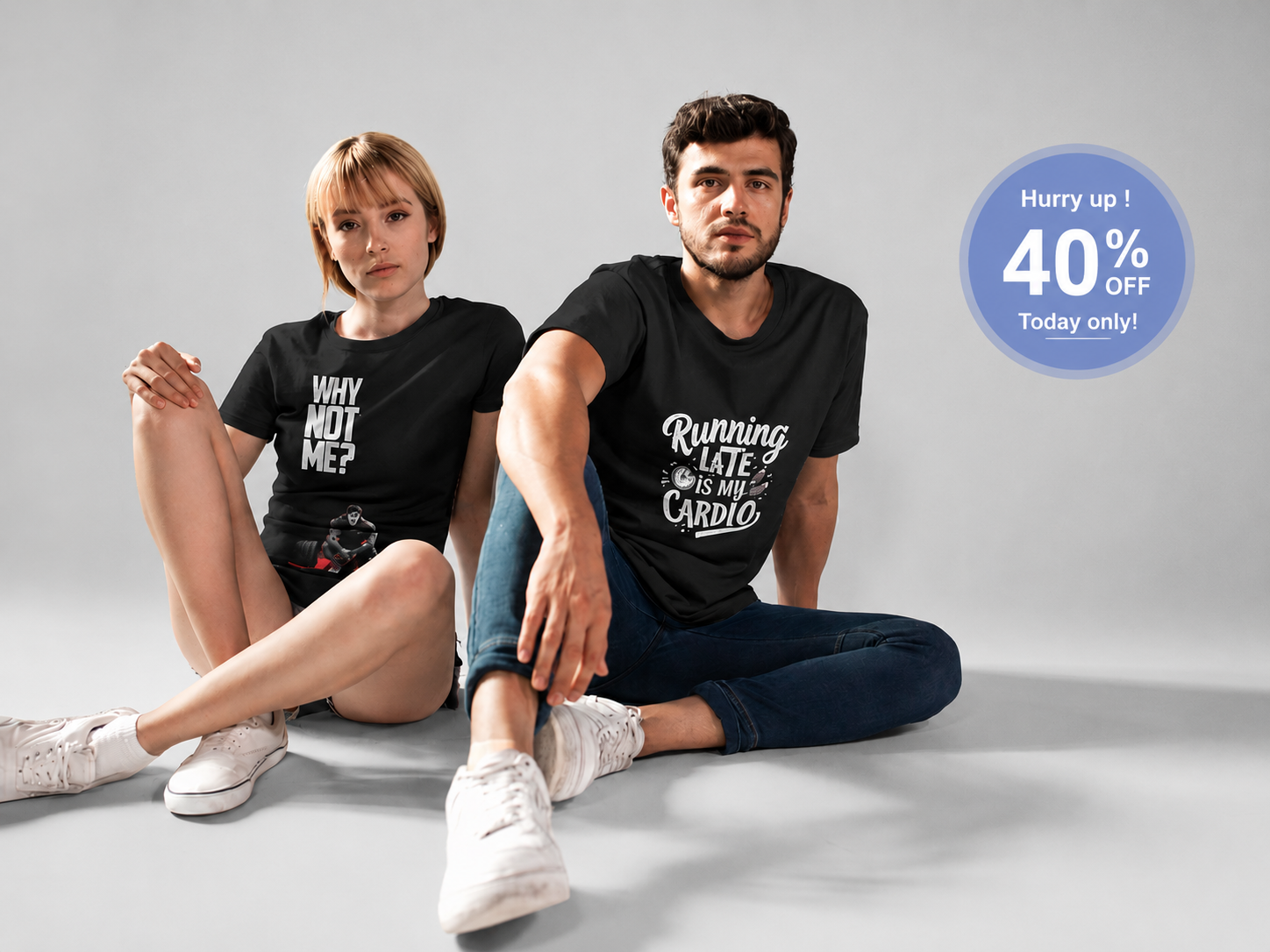 Two models wearing matching black graphic t-shirts in a studio setting. The woman's shirt reads 'WHY NOT ME?' and the man's shirt reads 'Running Late is My Cardio'.